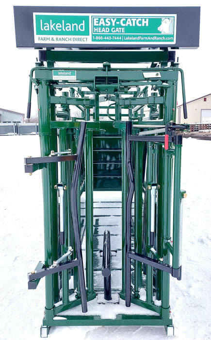 Farmer operating the C-Series Cattle Squeeze Chute to secure and inspect cattle safely