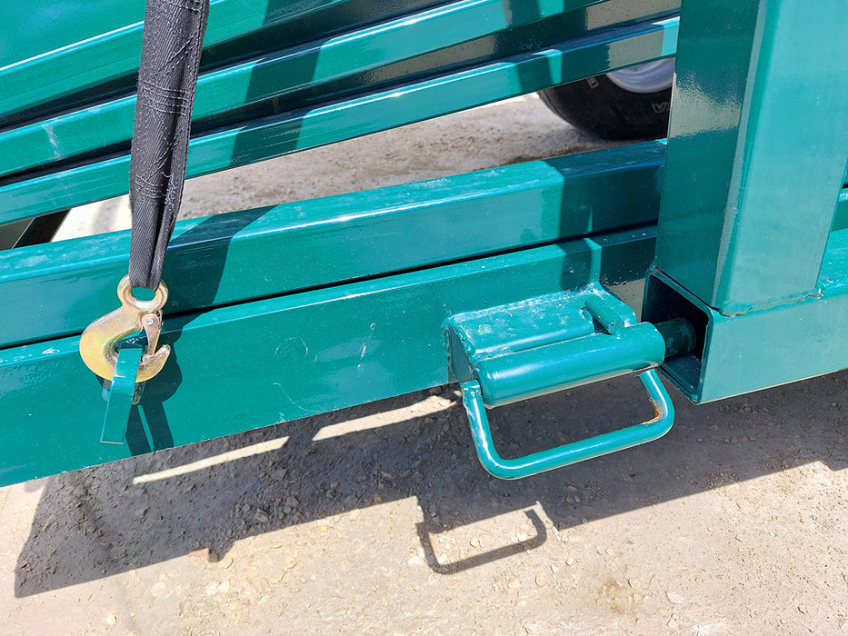 Side view of portable loading chute for cattle showing durable wheels and towing hitch for easy transport