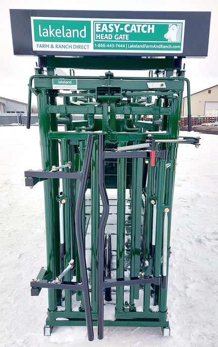 Operator using hydraulic head gate on Lakeland’s Easy Catch Cattle Squeeze Chute
