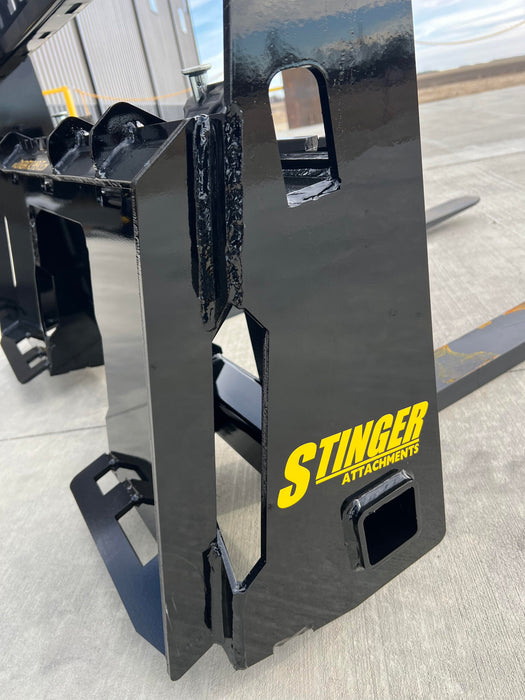 Front view of heavy-duty skid steer pallet forks by Stinger lifting materials – Class 2 model ensures stability and long-term performance.