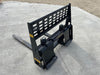 Heavy-duty Stinger skid steer pallet forks attached to loader – ideal for lifting pallets, lumber, and heavy equipment safely.