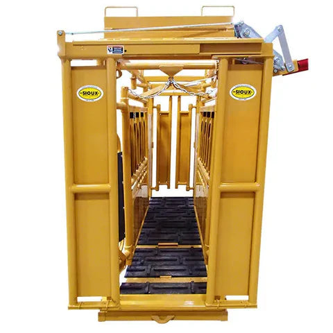 Side angle of Sioux Steel Cattle Chute showing durable steel frame and manual head gate for precise cattle control.