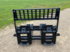 Durable Stinger Class 3 skid steer pallet forks transporting concrete blocks – precision-engineered for power, safety, and stability.