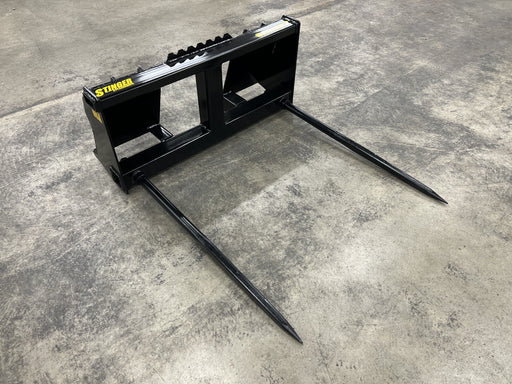 Stinger Series 2 dual-tine tractor bale spear lifting heavy round hay bale – durable bale spear engineered for superior strength and efficient farm handling.