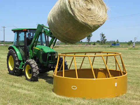 Ranch setup featuring Sioux Steel Bull cattle hay feeder designed for secure feeding of large round bales and reduced hay loss.