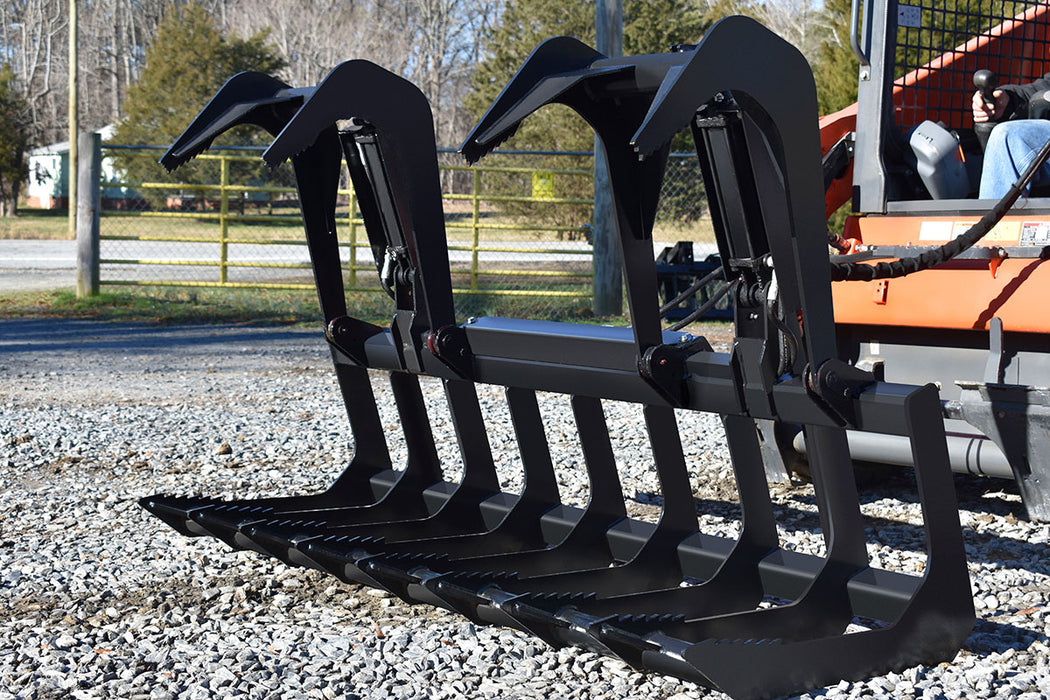 Loflin heavy-duty Root Grapple attachment for skid steer, designed for efficient handling of roots, brush, and debris during land clearing.