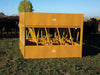 Ranch setup with Sioux Steel Square Hay Feeder built to handle large hay bales and withstand heavy livestock use.