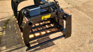 Close-up of Stinger manure tine grapple bucket tines and hydraulic arms – reinforced steel construction for long-lasting durability.