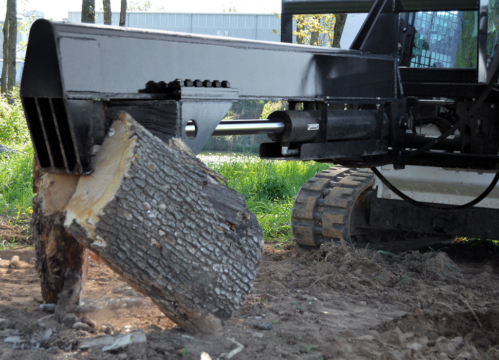 Loflin Fabrication 35-ton skid steer wood splitter splitting large logs with hydraulic power – heavy-duty attachment built for fast and efficient firewood production.